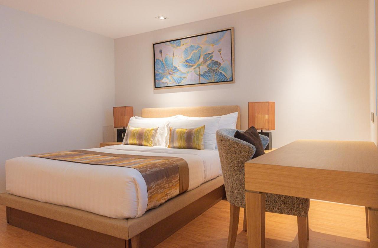 Summit Windmill Golf Suite Hotel At Suvarnabhumi Bangkok Exterior photo A bedroom at the hotel